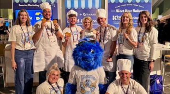 Members of the Kuno and StackAdapt team in front of their joint booth at INBOUND 2025