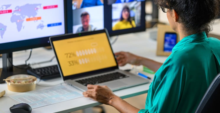 An office administrator viewing an informative B2B marketing video on a software solution for their business